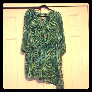 Long, sleek blouse with slanted bottom.